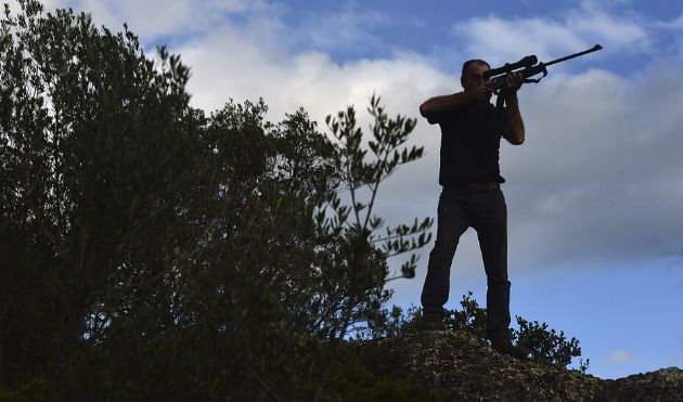 Un cazador en plena montería Un cazador en plena montería
